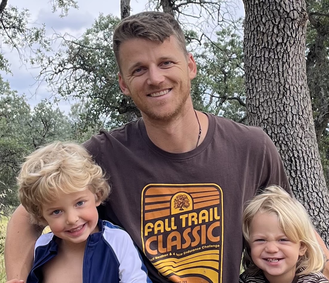Cole Henderson with two of his three kids on the trail